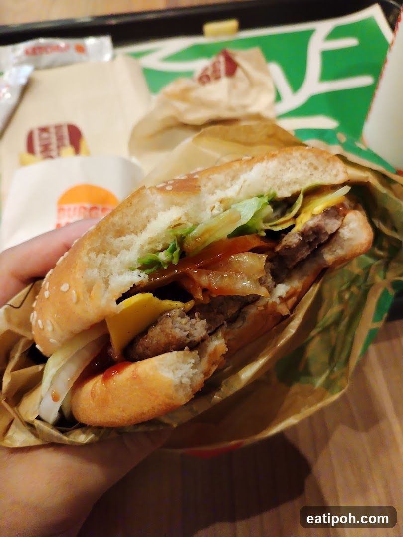 Hand holding burger