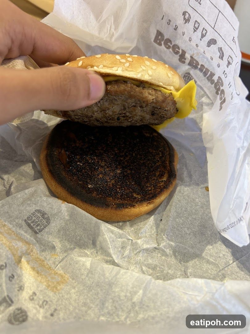 Burger being held open