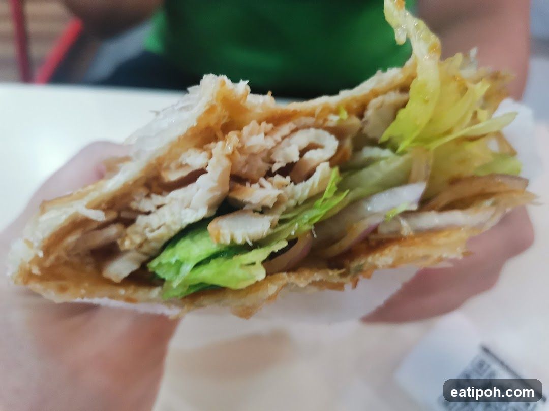 Hand holding a sandwich