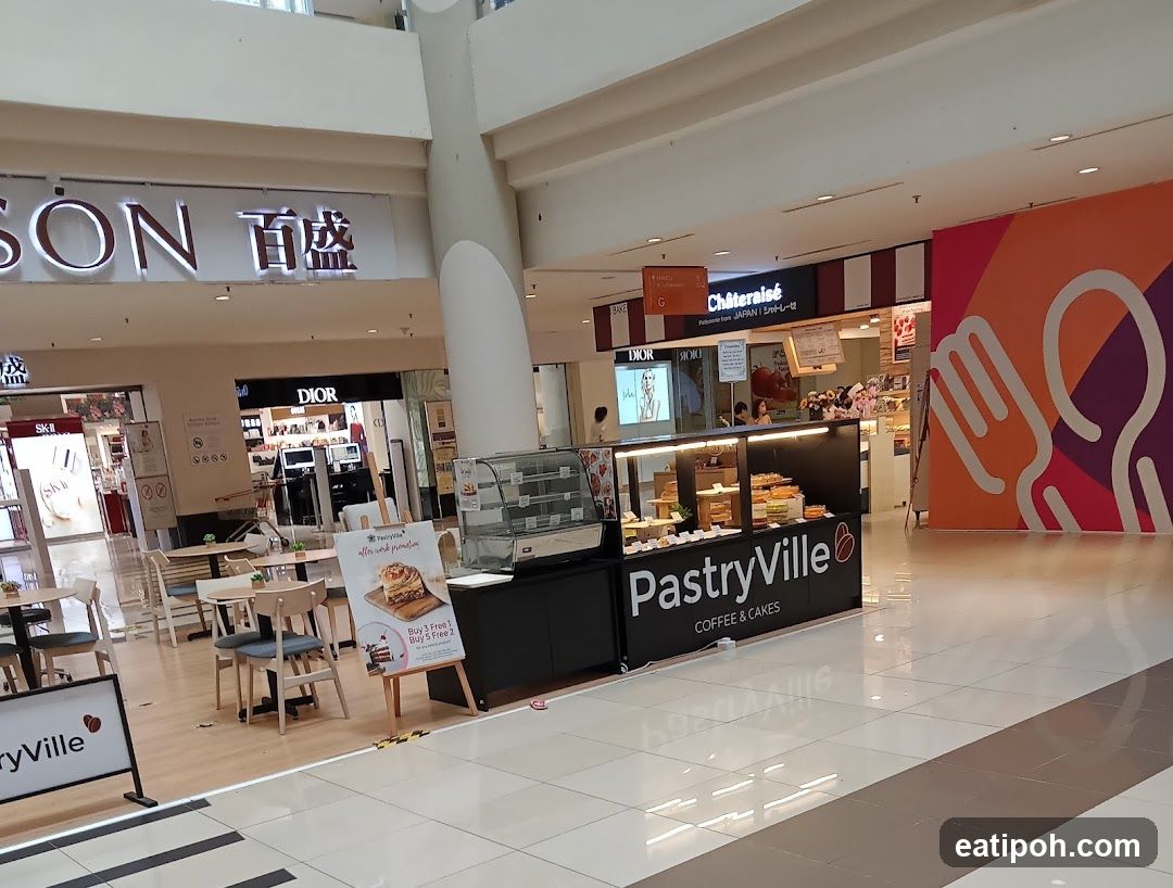 Interior of shopping mall with pastry stall