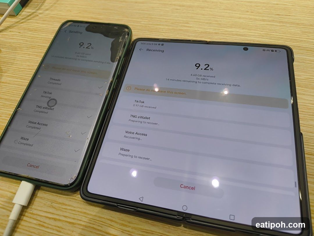 Two smartphones on a wooden surface