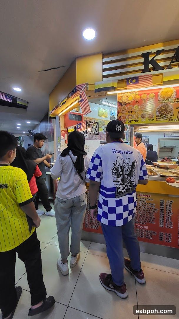 Food court interior with customers and stall
