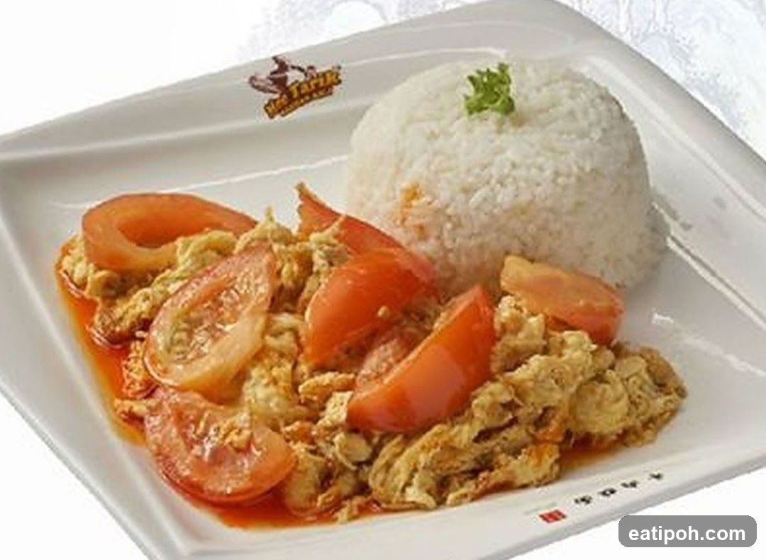 Scrambled Eggs with Tomatoes and Rice