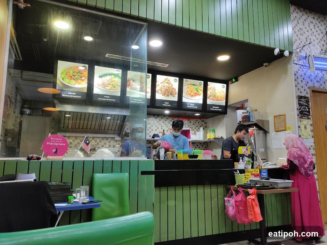 Restaurant interior with staff and customers