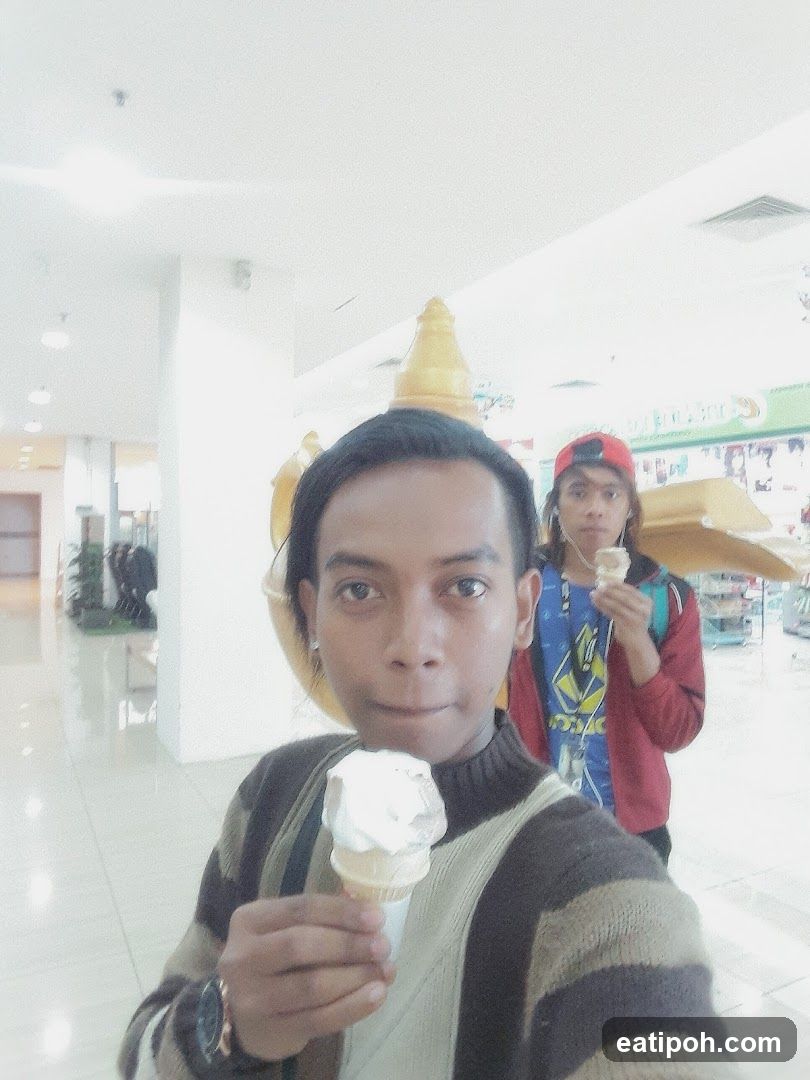 Indoor selfie with ice cream in shopping mall