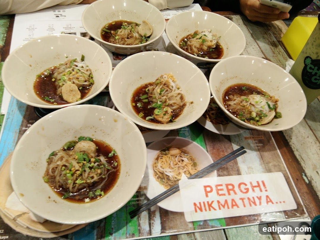 Table with bowls of noodles