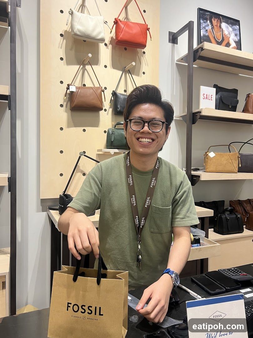 Sales Associate with Fossil Shopping Bag