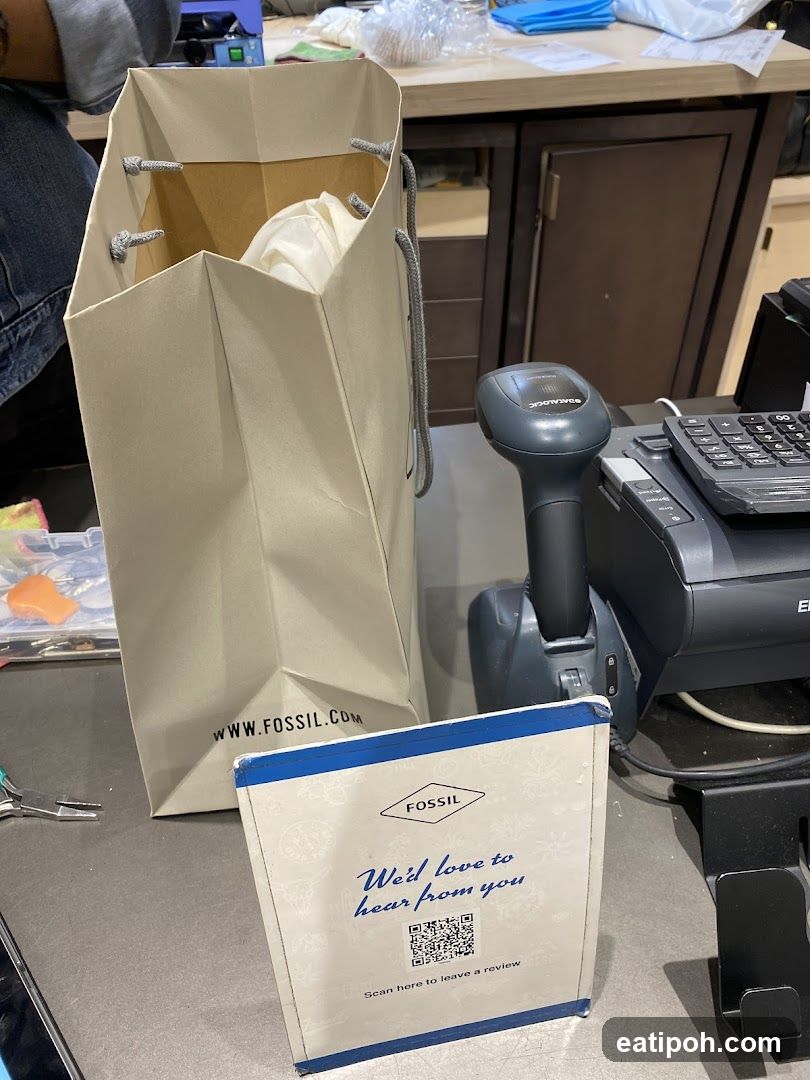 Fossil shopping bag and review sign