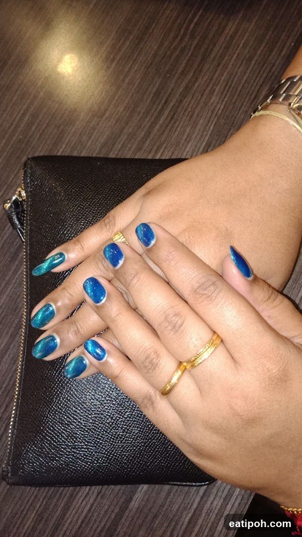 Hands with Blue Nails and Jewelry
