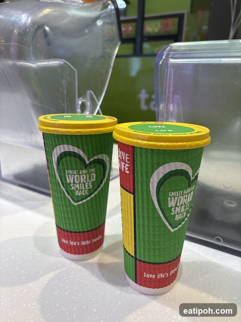 Two branded coffee cups on counter