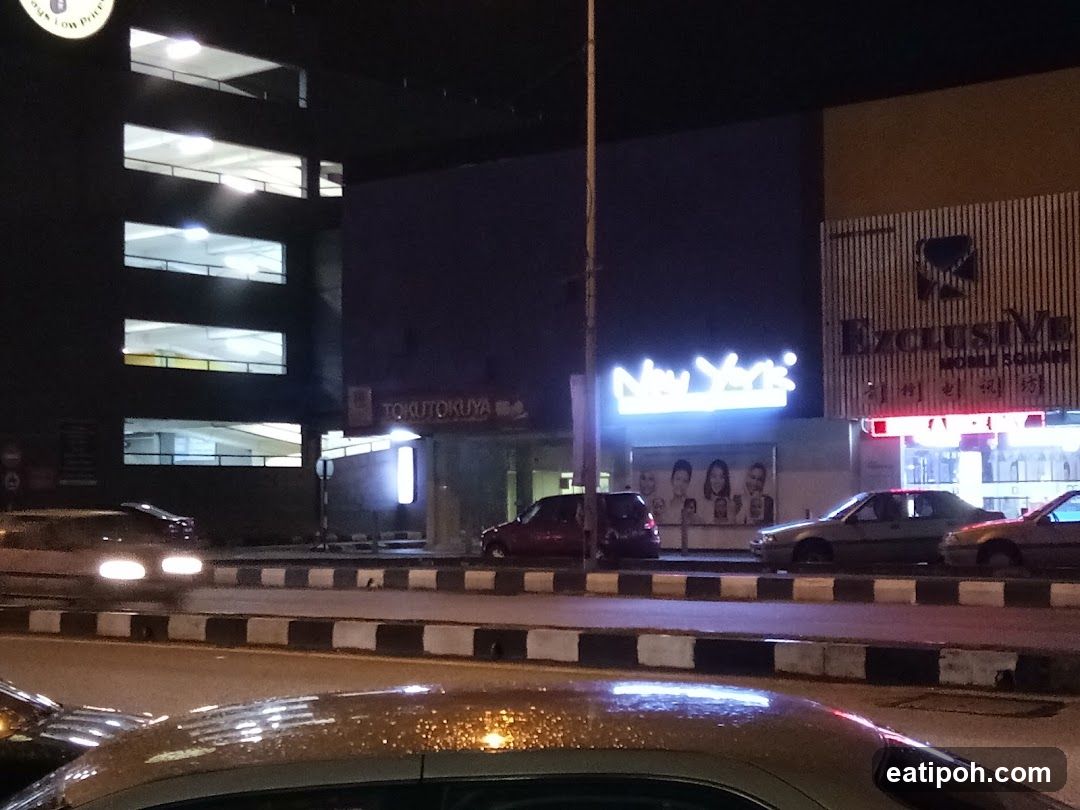 Nighttime street view with commercial buildings