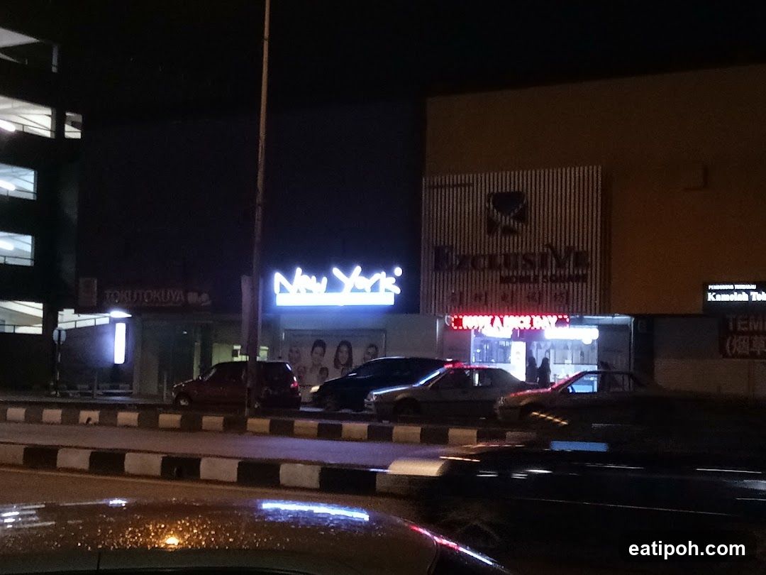 Nighttime street view with commercial buildings
