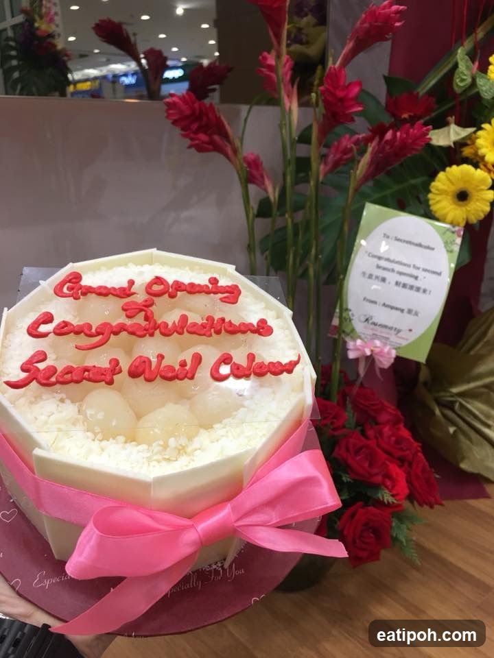 Grand Opening Celebration Cake and Floral Arrangement