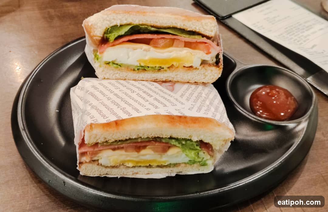 Sandwich and condiment on plate