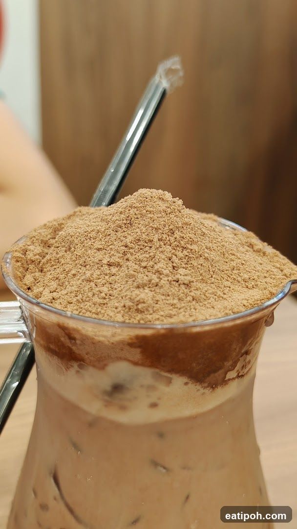 Iced beverage with powder topping
