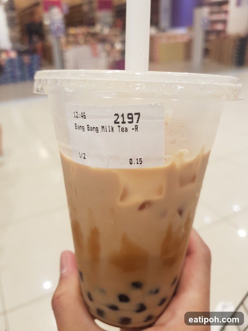 Hand holding iced milk tea
