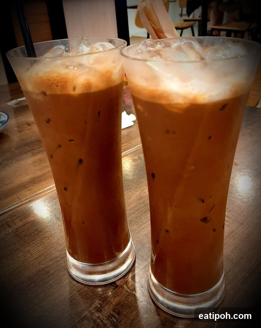 Two Iced Drinks on Wooden Table