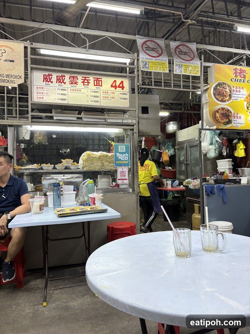 Food stall interior with customer and staff