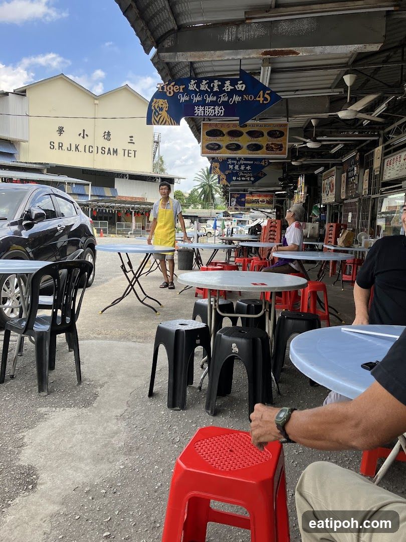 Outdoor food stall area with signage