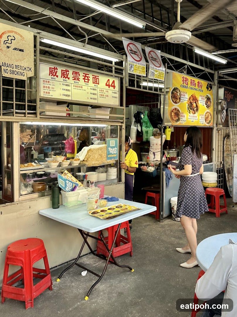 Food stall interior with customers and staff