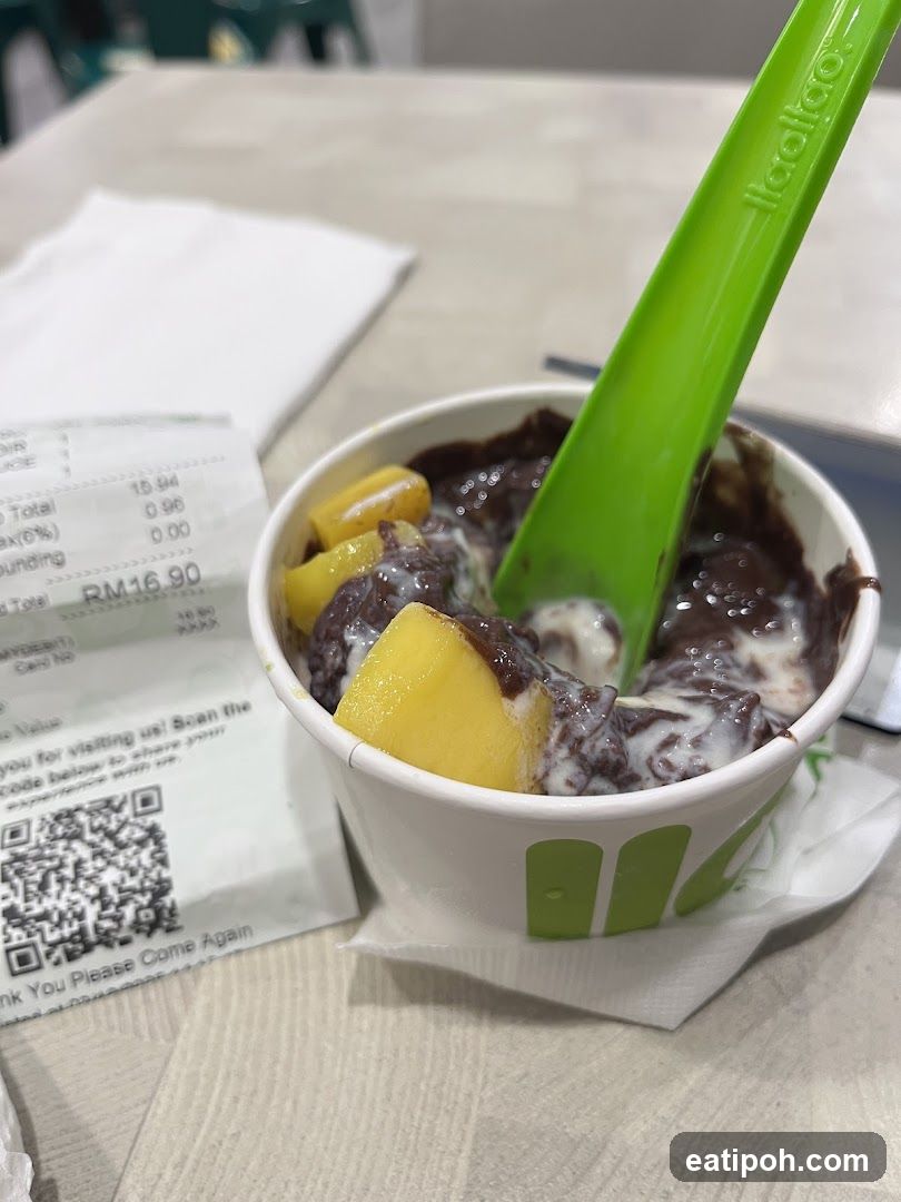 Ice cream cup with spoon on table