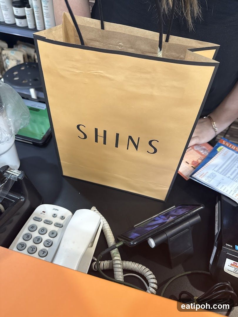 SHINS shopping bag at counter
