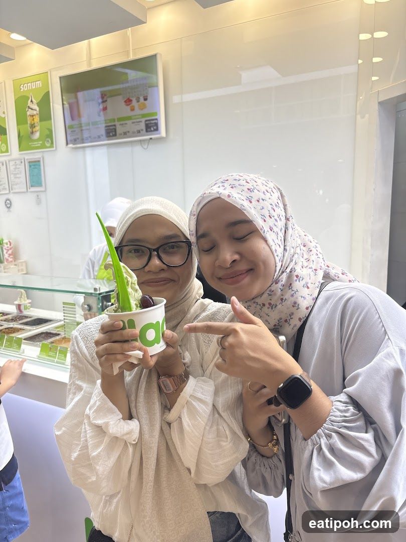 Two individuals in a frozen yogurt shop