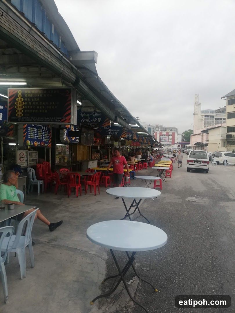 Outdoor street food stalls with seating area