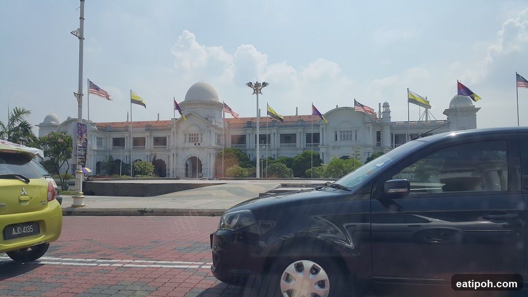 Building with Flags and Cars