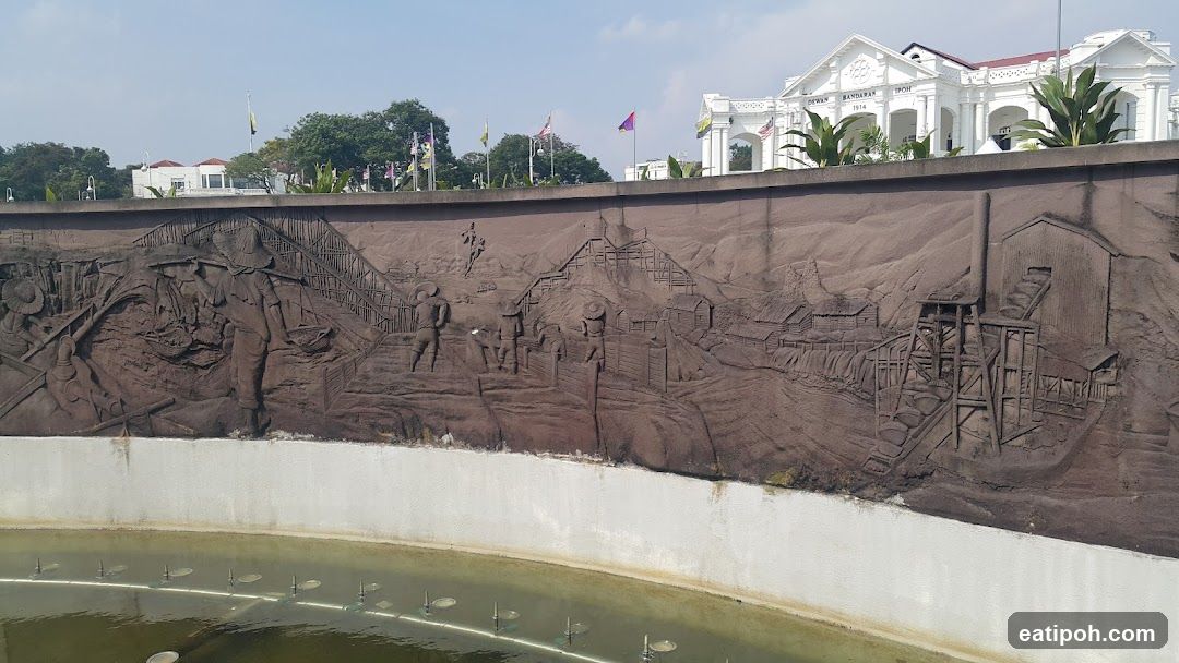Historical Relief Wall with Background Building