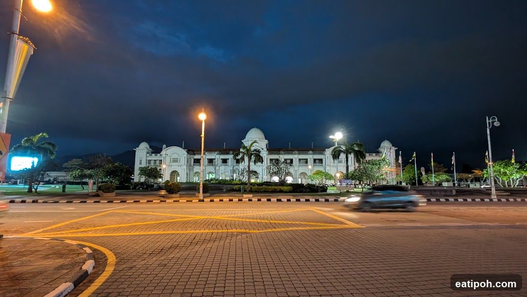 Nighttime view of a grand building with illuminated facade