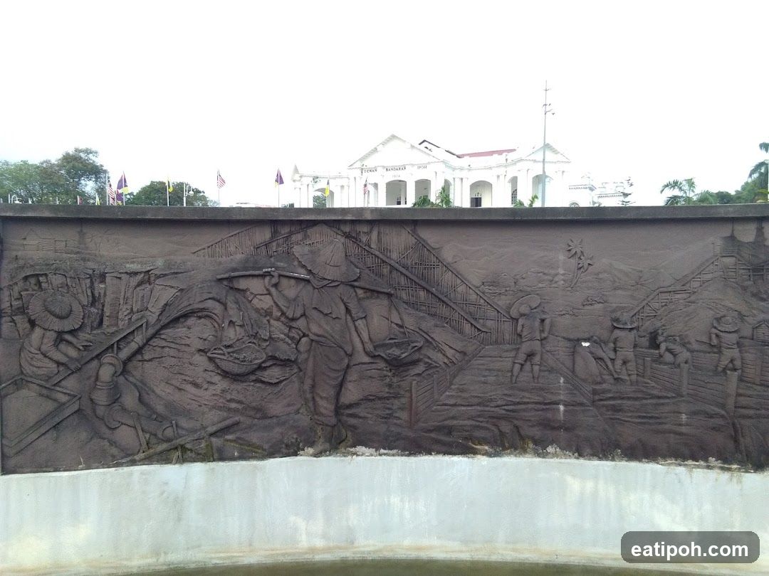 Historical Relief Wall with Building in Background