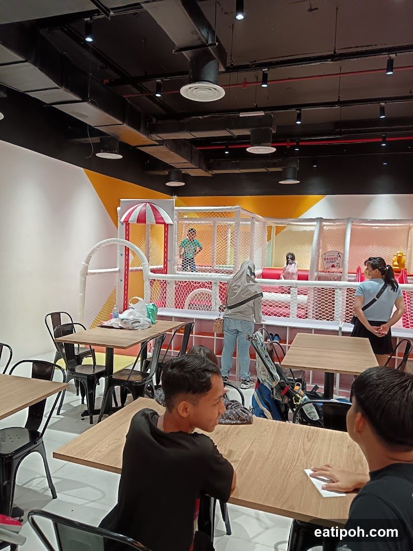 Indoor dining area with children's play zone