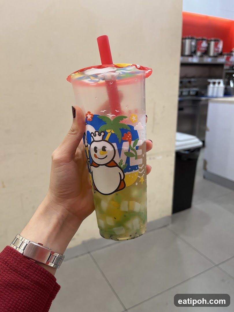 Hand holding a beverage cup