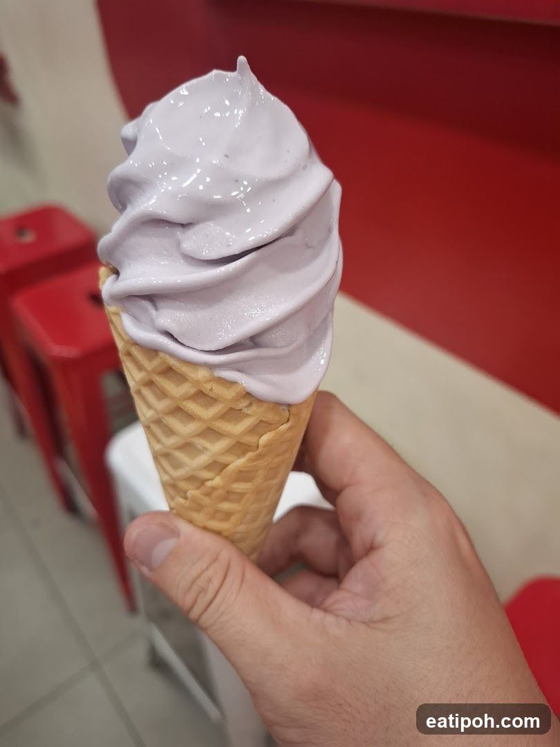 Hand holding ice cream cone