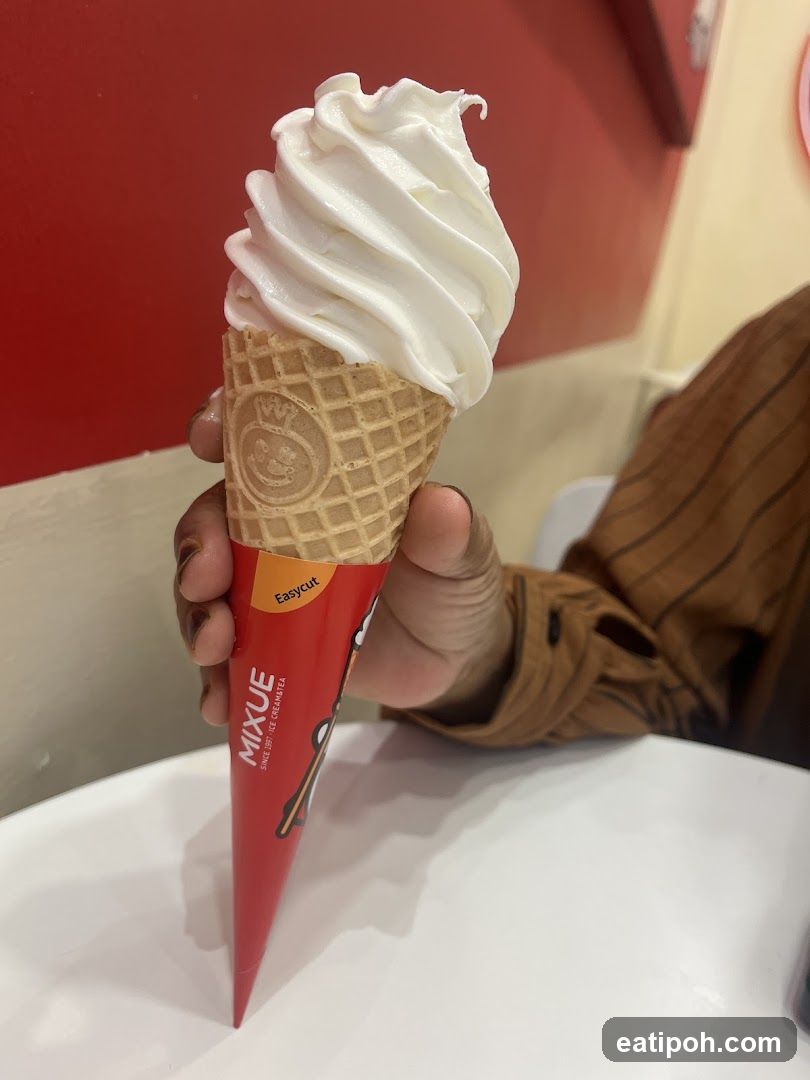 Hand holding ice cream cone