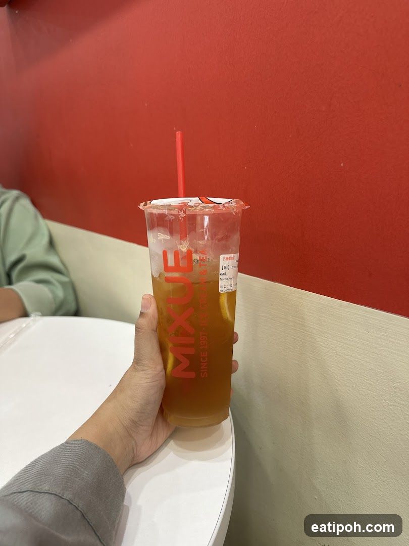 Hand holding a drink at a tea shop