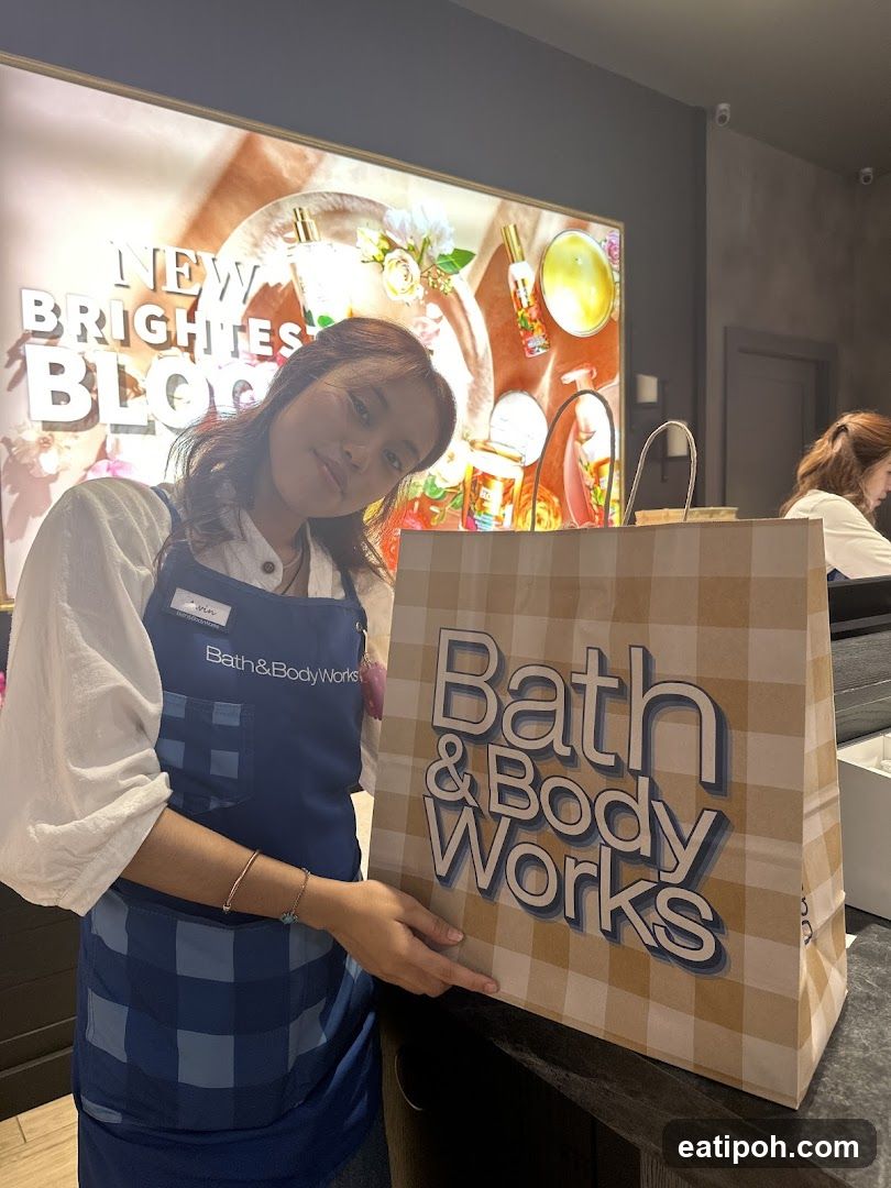Bath & Body Works employee with shopping bag