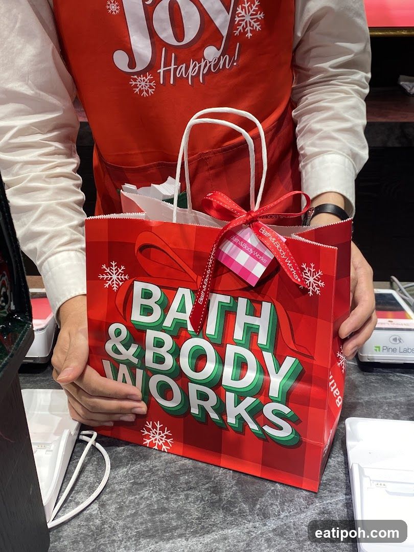 Bath & Body Works employee holding shopping bag