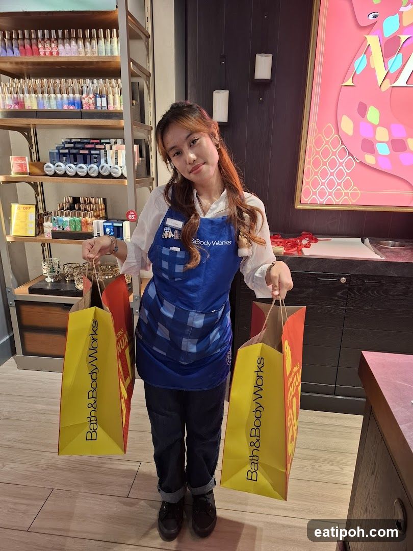 Bath & Body Works Employee Holding Shopping Bags