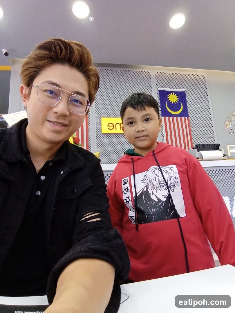 Interior selfie with two individuals