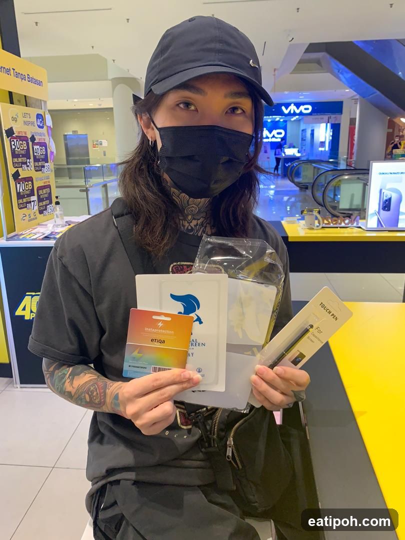 Person holding products in shopping mall