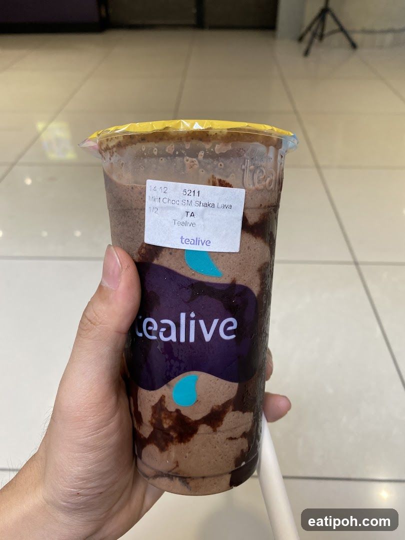 Hand holding a Tealive drink