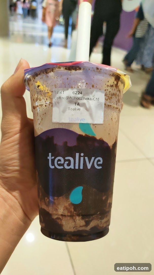 Tealive drink held in hand