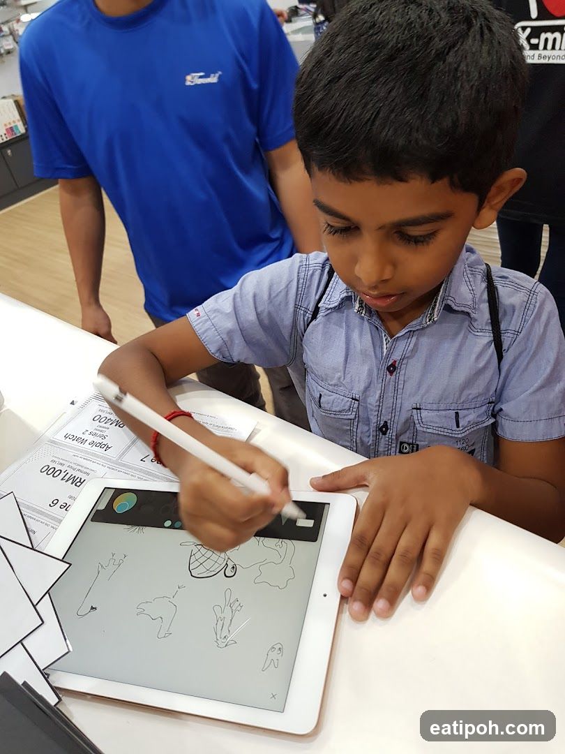 Child drawing on tablet in store