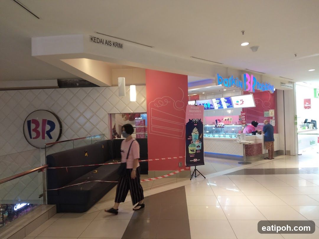 Inside a shopping mall with a branded ice cream shop