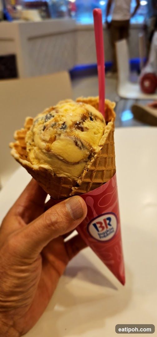 Hand holding ice cream cone