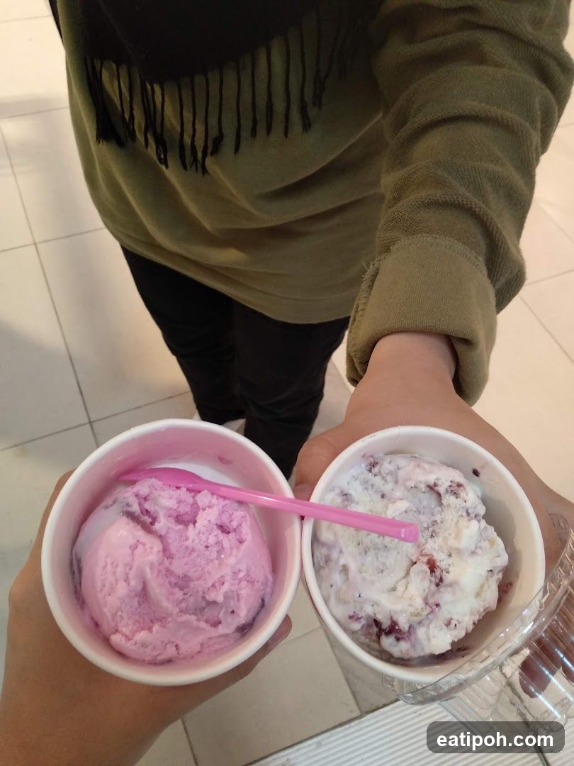Ice Cream Cups Held by Two People