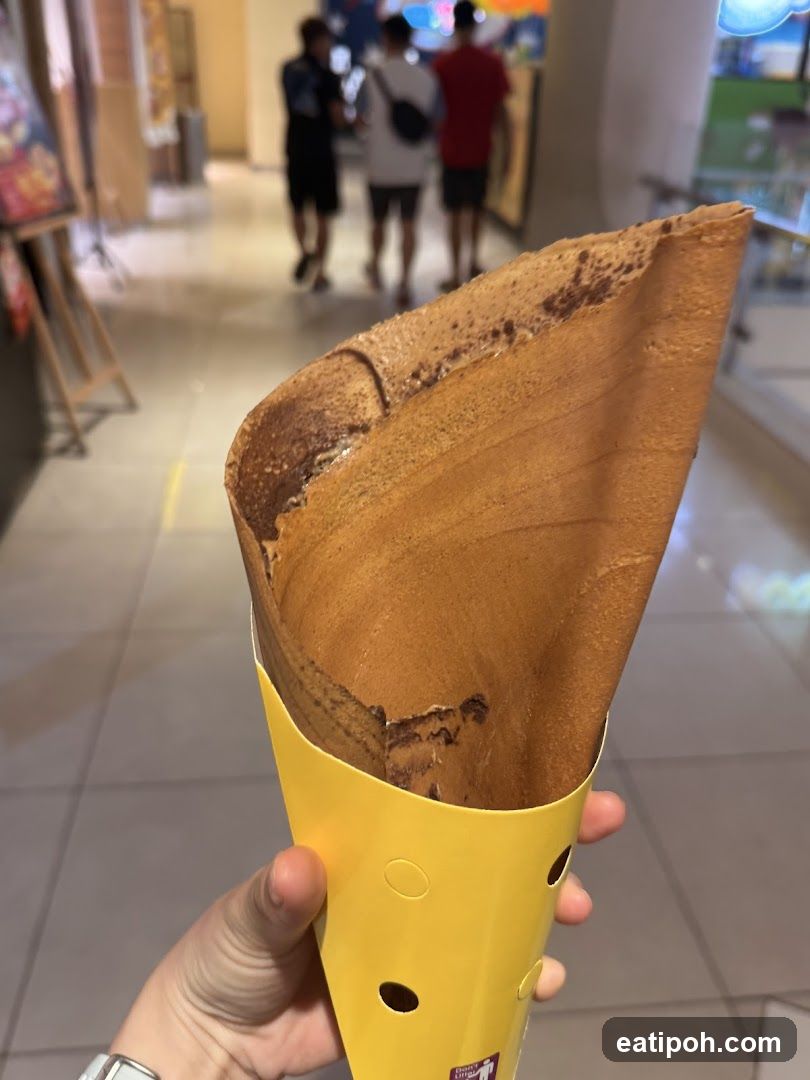 Hand holding a dessert cone
