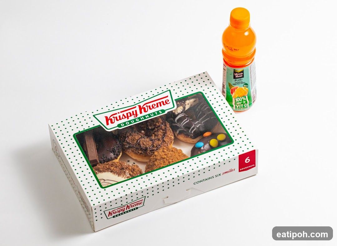 Krispy Kreme Doughnuts Box and Orange Drink